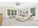 Spacious main bedroom with lots of natural light and neutral tones at 8937 Penstemons Dr, Charlotte, NC 28215
