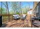 Comfortable seating on the back deck with a view of the trees and another home at 912 Westside Dr, Newton, NC 28658