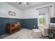 Bedroom/bedroom with gray and white wall paneling and a small crib at 912 Westside Dr, Newton, NC 28658