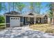 Charming single Gathering home boasts a modern design, a one-car garage, and a welcoming front porch at 912 Westside Dr, Newton, NC 28658
