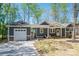 Charming single Gathering home boasts a modern design, a one-car garage, and a welcoming front porch at 912 Westside Dr, Newton, NC 28658