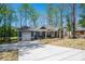 Charming single-story home with a garage and a concrete driveway and beautifully landscaped front yard at 912 Westside Dr, Newton, NC 28658