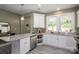 Bright kitchen features white cabinets, granite countertops and modern stainless steel appliances at 912 Westside Dr, Newton, NC 28658