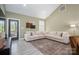Spacious living room with large sectional sofa, and access to an outdoor deck at 912 Westside Dr, Newton, NC 28658