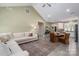 Open-concept living space with vaulted ceiling, seamlessly connecting living and dining areas at 912 Westside Dr, Newton, NC 28658