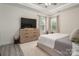 Comfortable bedroom with a large dresser, TV, and natural light at 912 Westside Dr, Newton, NC 28658