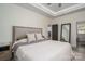 Main bedroom with ceiling fan, tray ceiling, and ensuite bathroom at 912 Westside Dr, Newton, NC 28658