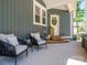 Inviting covered patio with comfortable seating, ideal for relaxing outdoors at 912 Westside Dr, Newton, NC 28658