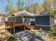 Rear view of house with backyard area and patio with firepit at 912 Westside Dr, Newton, NC 28658
