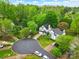 Aerial view of the homes in a suburban cul-de-sac, showcasing tree lined streets and well-manicured lawns at 9209 Rotherham Ln, Charlotte, NC 28216