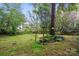 Private backyard with mature trees and lush greenery at 9209 Rotherham Ln, Charlotte, NC 28216