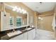 Bathroom with double sinks, granite countertops, and a tiled shower and tub combination at 9209 Rotherham Ln, Charlotte, NC 28216