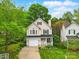 Charming two-story home boasts lush landscaping, a welcoming porch, and an attached garage for modern suburban living at 9209 Rotherham Ln, Charlotte, NC 28216