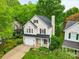Charming two-story home boasts lush landscaping, a welcoming porch, and an attached garage for modern suburban living at 9209 Rotherham Ln, Charlotte, NC 28216