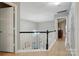 Open hallway with a view of the living room below at 9209 Rotherham Ln, Charlotte, NC 28216