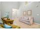 Bright, airy living room with vaulted ceiling, featuring comfortable seating and staircase to the second floor at 9209 Rotherham Ln, Charlotte, NC 28216