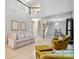 Bright, airy living room with vaulted ceiling, featuring comfortable seating and staircase to the second floor at 9209 Rotherham Ln, Charlotte, NC 28216