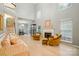 Bright living room with vaulted ceiling, showcasing the fireplace, staircase, and stylish decor at 9209 Rotherham Ln, Charlotte, NC 28216
