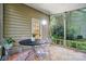 Inviting screened-in porch with stylish seating, perfect for outdoor relaxation and entertaining at 9209 Rotherham Ln, Charlotte, NC 28216