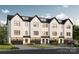 Modern townhome exterior featuring white siding, black trim, and individual garages in a desirable community at Lot 13 Pleasant Rd, Fort Mill, SC 29708