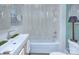 Cozy bathroom featuring a shower-tub combo and a well-lit sink at 1000 E 35Th St, Charlotte, NC 28205