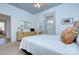 Bedroom with a cozy bed, a dresser with a mirror, two windows, and carpeted floors at 1000 E 35Th St, Charlotte, NC 28205