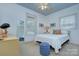 Bright bedroom with a ceiling fan, neutral walls, carpeted floors, and dual pane windows, creating a cozy, comfortable atmosphere at 1000 E 35Th St, Charlotte, NC 28205