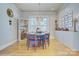 Bright dining room with unique decor and hardwood floors at 1000 E 35Th St, Charlotte, NC 28205