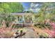 Charming craftsman-style home with inviting front porch and mature landscaping at 1000 E 35Th St, Charlotte, NC 28205