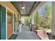 Inviting covered front porch with detailed trim and ample seating area at 1000 E 35Th St, Charlotte, NC 28205