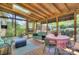 Bright sunroom with wood ceiling, skylight, and outdoor furniture set at 1000 E 35Th St, Charlotte, NC 28205
