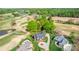 Stunning aerial view of luxury homes on a golf course with mature trees and meticulously landscaped yards at 105 Snead Ct, Salisbury, NC 28144