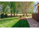 Picturesque backyard has manicured lawn, trees and golf course views at 105 Snead Ct, Salisbury, NC 28144