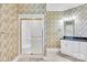 Bathroom featuring a shower, single vanity, and patterned wallpaper at 105 Snead Ct, Salisbury, NC 28144