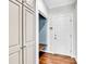 Bright entryway featuring hardwood floors, white door, and custom built-in storage with a bench at 105 Snead Ct, Salisbury, NC 28144
