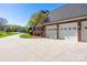 Spacious three-car garage with paved driveway offers ample parking and curb appeal at 105 Snead Ct, Salisbury, NC 28144
