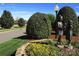 Charming community landscaping with stone accents, colorful flowers, and verdant shrubbery at 105 Snead Ct, Salisbury, NC 28144