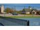Tennis court with view of the clubhouse, water tower, and parking for added convenience at 105 Snead Ct, Salisbury, NC 28144