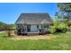 Cozy home exterior featuring a deck and lush landscaping for serene outdoor living at 1050 Merrywood Dr, Newton, NC 28658