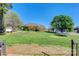 Lush backyard featuring mature trees, recreational equipment, and plenty of space for outdoor activities at 1050 Merrywood Dr, Newton, NC 28658