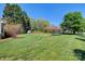 Expansive backyard with a trampoline and ample green space for recreation and leisure at 1050 Merrywood Dr, Newton, NC 28658