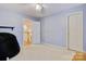 Bright bedroom features a door to the landing, carpet, beanbag chair, and a second door at 1050 Merrywood Dr, Newton, NC 28658