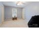 Spacious bedroom featuring a window, neutral carpet, and plenty of natural light at 1050 Merrywood Dr, Newton, NC 28658