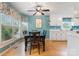 Eat-in kitchen with bay window, wood floors, and a view to the backyard at 1050 Merrywood Dr, Newton, NC 28658