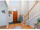 Inviting foyer with hardwood floors, staircase, and natural light creating a warm entrance at 1050 Merrywood Dr, Newton, NC 28658
