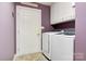Functional laundry room with washer, dryer, and cabinet space for storage at 1050 Merrywood Dr, Newton, NC 28658