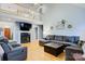 Bright living room with hardwood floors, fireplace, vaulted ceilings, and second floor balcony at 1050 Merrywood Dr, Newton, NC 28658