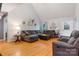 Spacious living room with vaulted ceiling, hardwood floors, and ample seating for comfortable gatherings at 1050 Merrywood Dr, Newton, NC 28658