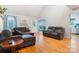 Bright living room with hardwood floors, comfortable seating, and natural light creating an inviting space at 1050 Merrywood Dr, Newton, NC 28658