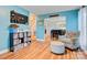 Inviting living room with wood floors and view of the dining room, stairs, and 'Peace' sign at 1050 Merrywood Dr, Newton, NC 28658